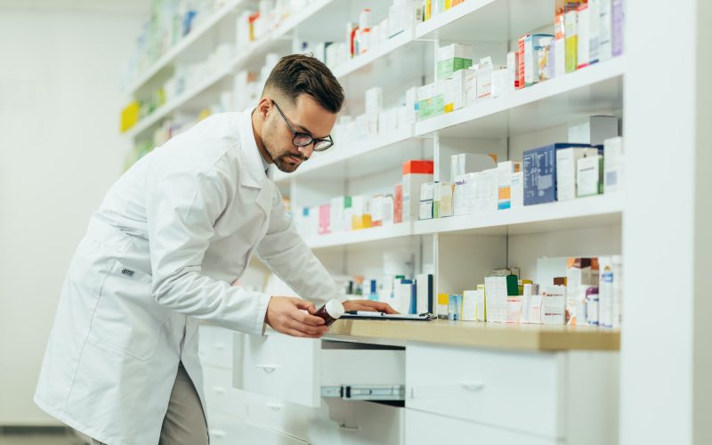 portrait-of-a-handsome-pharmacist-working-in-a-pharmacy.jpg